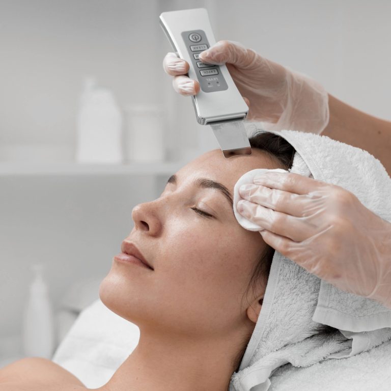beautician-doing-face-beauty-routine-female-client-min-scaled